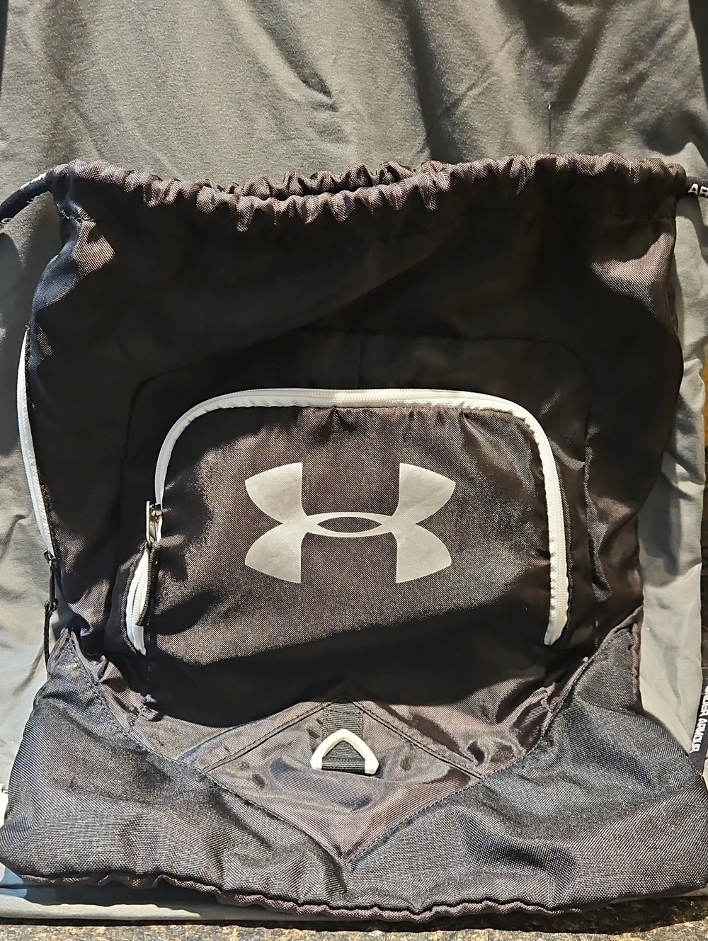 Under Armour Black Drawstring Backpack with White Trim and Front Pocket